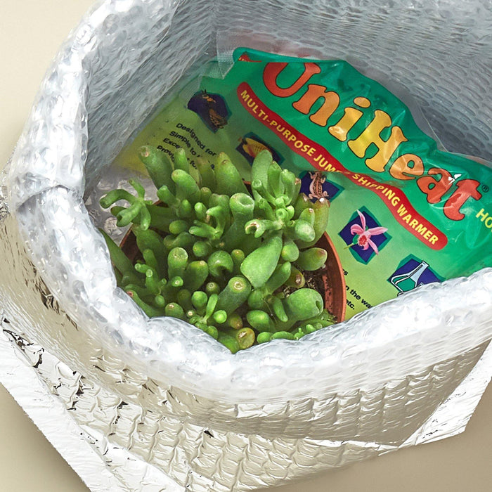 Insulated Sleeve with a heat pack for size comparison. Insulated sleeve for shipping temperature sensitive items.